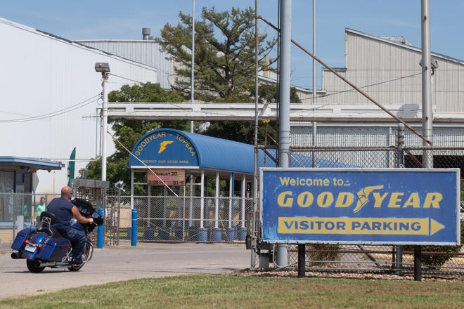 Employees enter Topeka's Goodyear distribution center. The company was awarded cash incentives Wednesday to expand its Topeka operations.