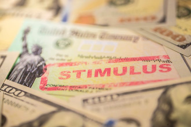 Stimulus check with hundred dollar bills