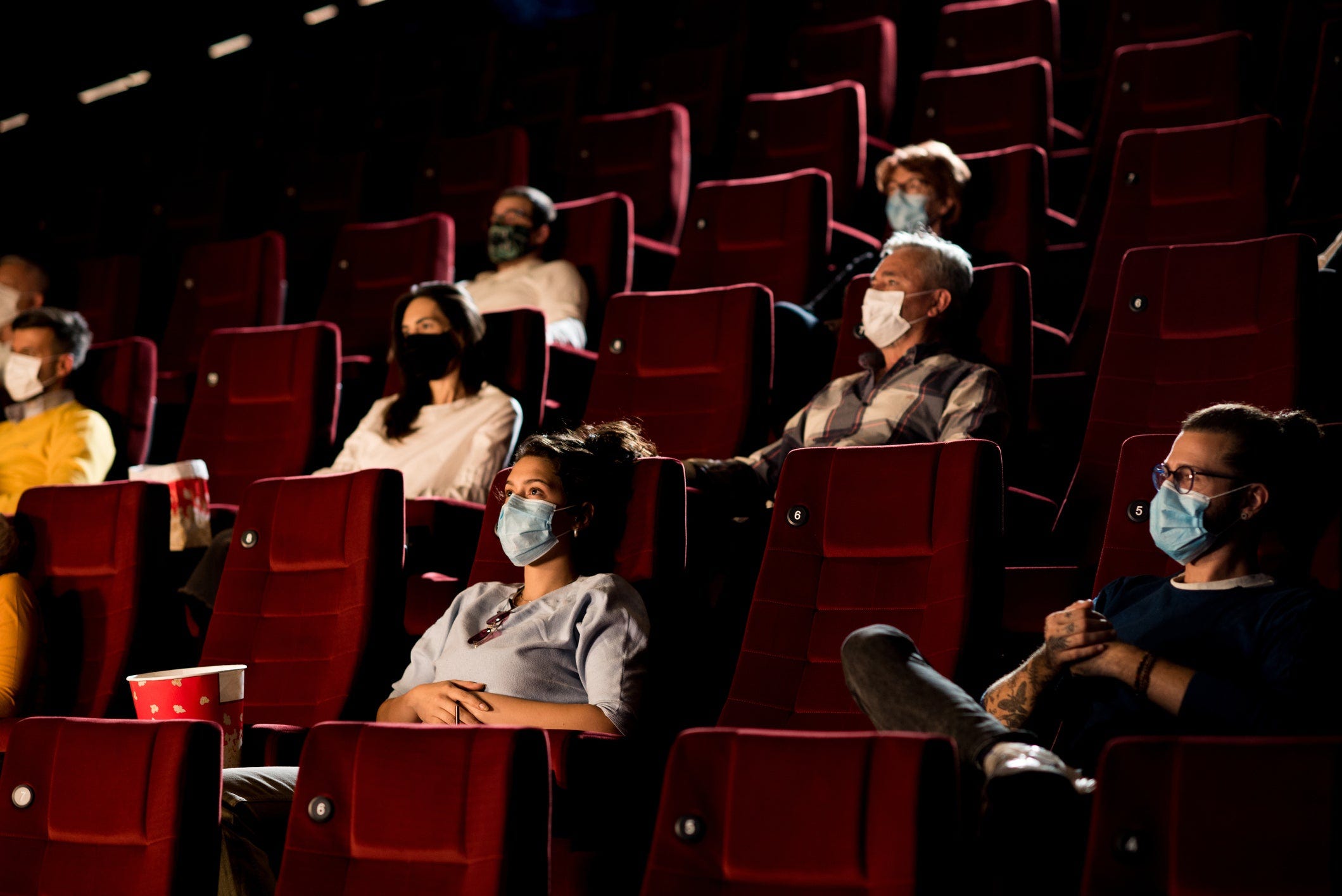 Masked moviegoers in theater