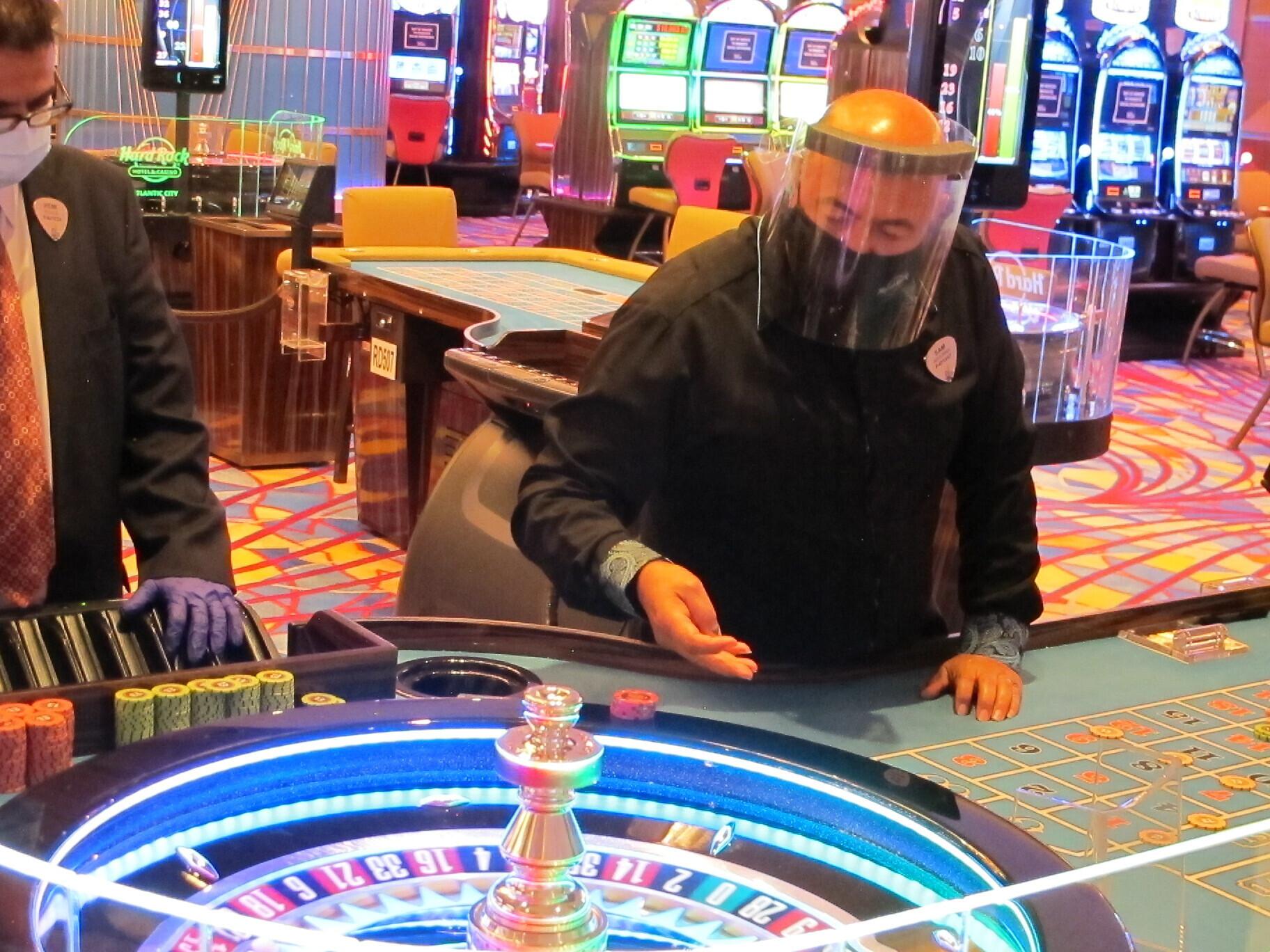 A dealer conducts a game of roulette at the Hard Rock Casino in Atlantic City, N.J., on July 2, 2020, the first day the casino was allowed to reopen during the coronavirus pandemic.