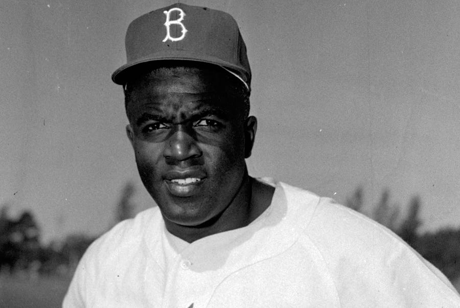 FILE - This is a March 1956 file photo showing Brooklyn Dodgers baseball player Jackie Robinson in Vero Beach, Fla. All players, managers, coaches and umpires will wear No. 42 on Thursday, April 15, 2021, to celebrate Jackie Robinson Day, marking the anniversary of the date the Brooklyn Dodgers Hall of Famer made his Major League Baseball debut and broke the sport's color barrier in 1947. (AP Photo/File)