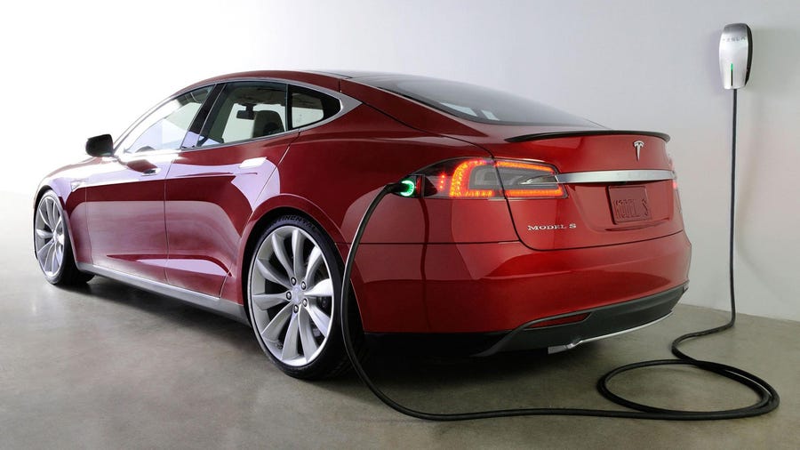 A Tesla Model S plugged in for charging.