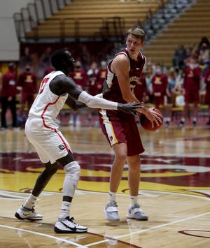 Northern State forward Jordan Belka drives against Minnesota State. Moorhead's Siman Sem during a February game at the Barnett Center. The Wolves open their home conference slate Saturday against the University of Mary. Belka is off to a strong start this season for Northern. American News file photo