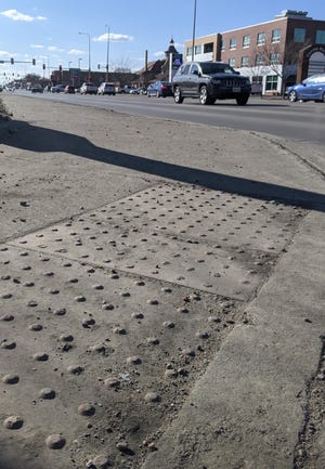 Sidewalk ramps that meet US Disability Act standards.