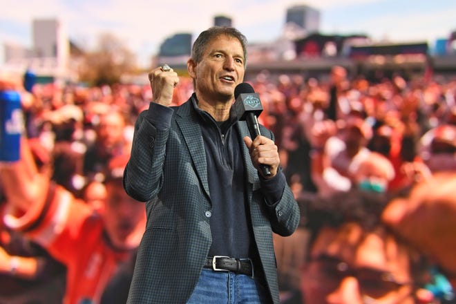 Former Cleveland Browns quarterback Bernie Kosar speaks to fans during the fourth round of the NFL football draft, Saturday, May 1, 2021, in Cleveland. (AP Photo/David Dermer)