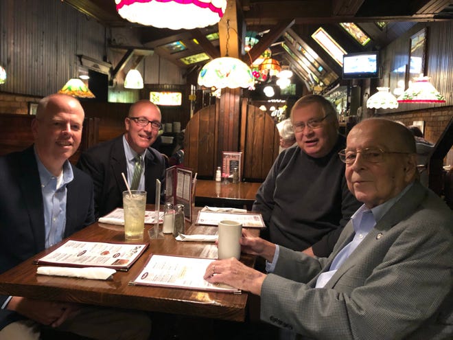Current Mishawaka Mayor Dave Wood, second from left, sits with former mayors Jeff Rea, left, Bob Kovach, second from right, and Bob Beutter inside Doc Pierce’s in 2018. Photo courtesy of Dave Wood.