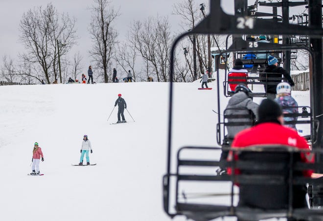 Skiers and snowboarders take to the slopes at Swiss Valley Ski &amp; Snowboard Area on opening day, Monday, Dec. 28, 2020, in Jones.