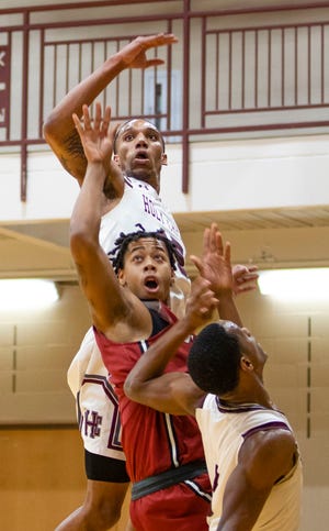 Donyell Meredith II (center) is a key performer for the IUSB men's basketball team that is headed to the NAIA National Tournament starting Friday.