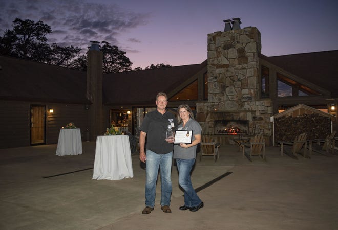 Keith and Lisa Welch of Tall Pines Distillery in Salisbury were selected as the Pathfinder of the Year at the 61st Laurel Highlands Visitors Bureau Annual Tourism Dinner, which took place at Laurel Mountain Ski Resort on Tuesday evening. The award is presented to an individual or organization that “carves a path for something they love, and by so doing, lead visitors to the Laurel Highlands and to their front door,” according to the bureau. The distillery’s products were incorporated into signature cocktails for the event. Donna Holdorf, executive director of the National Road Heritage Corridor, was named Trailblazer of the Year. Dean Simpson, marketing manager for Touchstone Center for Crafts, was named Tourism Employee of the Year.