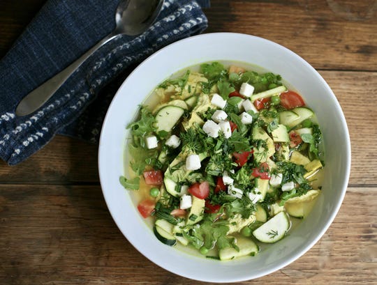 Spring chicken and greens soup. (Dakota Mackey/The Daily Meal/TNS)