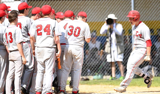 Conemaugh Township’s Devin Foster crosses the plate as his teammates wait to celebrate his first-inning solo home run against North Star in the District 5-AA championship Tuesday in Shanksville.