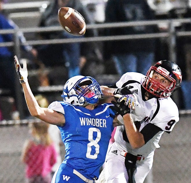 Windber’s Jeremy Layton (8) breaks up a pass intended for Meyersdale’s Kyle Sigler in a key WestPAC matchup Friday night in Windber.