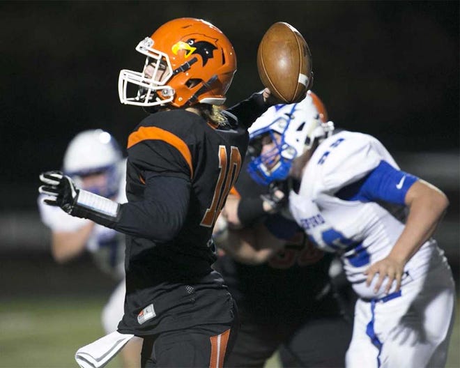 Somerset quarterback Camron Coddington drops back for a pass late in the second quarter Friday night against Bedford.