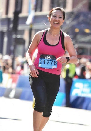 Lynn Singer runs the 120th Boston Marathon on April 18.