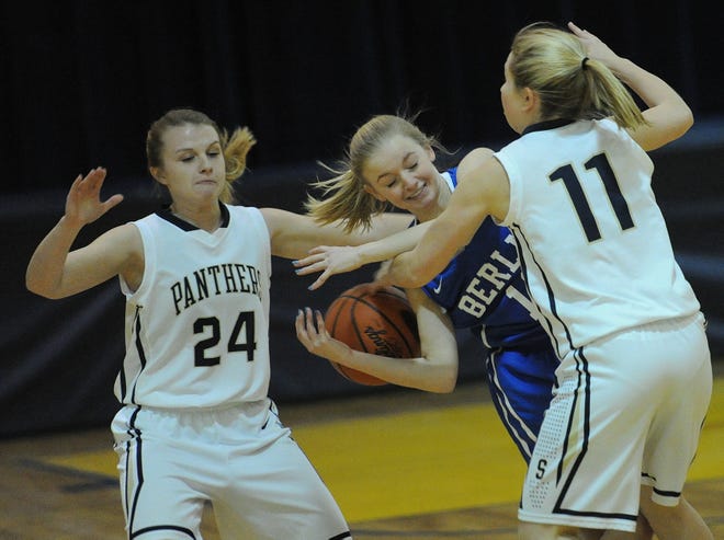 Shade’s Mikayla Ott (24) and Emma Spinelli (11) harass Berlin’s Geordan Hay in WestPAC action Monday night in Cairnbrook.