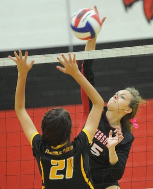 Meyersdale’s Jackie McKenzie works the ball over the net against Ferndale’s Lana Maniahkina in WestPAC volleyball action Thursday night in Meyersdale.