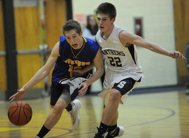 Shanksville’s Aaron Smith pushes the ball up the floor against Shade’s Johnny Mauger Monday night in Cairnbrook.