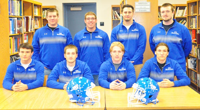 Eight Berlin football players signed letters of intent to continue their athletic and academic careers Monday at the Berlin High School Library. They are, pictured, from left, (front) Nicholas Brown, Braden Fochtman, Brentson Harding and Zane Yanosky, (back) Andy Lasure, Ryan Landis, Austin Kalina and Dante Paul.