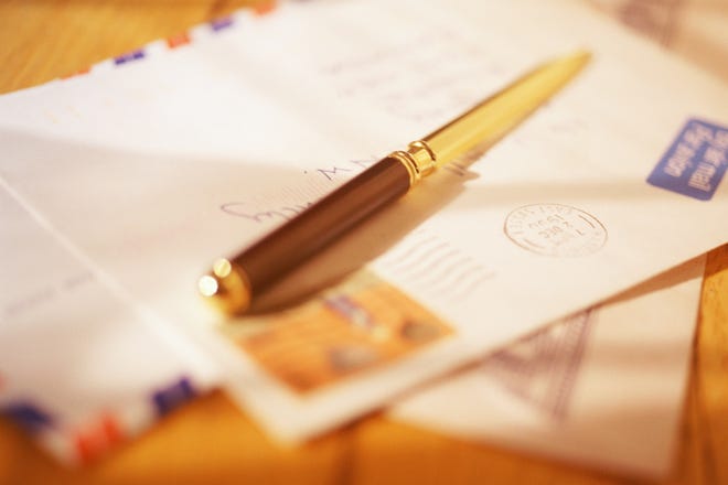 Letter opener resting on air mail envelope
