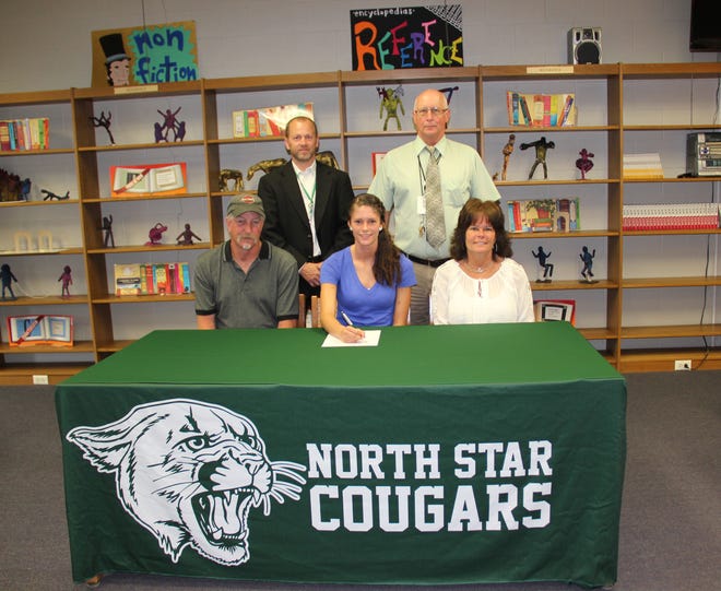North Star’s Cheyenne Kuncher (seated, center) signs a national letter of intent to play soccer at Wheeling Jesuit University. She is joined by her parents, seated, Randy and Tammi Kuncher, and standing high school principal Louis Lepley and athletic director Stacy Schmitt.
