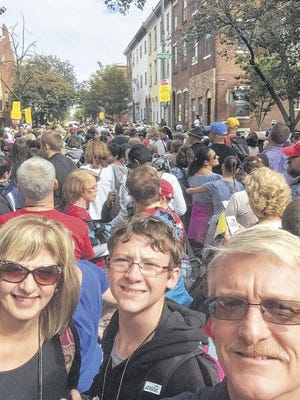 Somerset Borough resident Mike Kuhn (right) takes a selfie with his son, Patrick, and Wife, Karen, Sunday in Philadelphia during Pope Francis' visit to the City of Brotherly Love. The Kuhns were among a group of several Somerset County residents who traveled with the Altoona-Johnstown Roman Catholic Diocese to Philadelphia for the pontiff's visit. Submitted photo