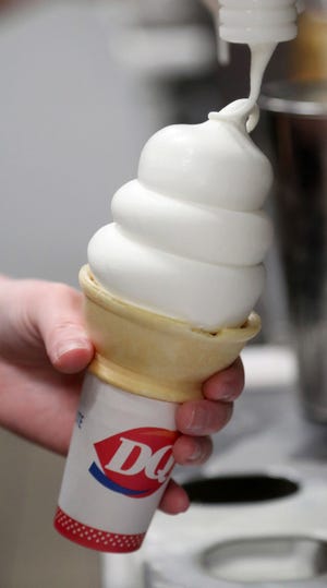 An employee at Dairy Queen in Aberdeen puts a patented DQ curl on a cone. American News photo by John Davis taken 7/18/2019