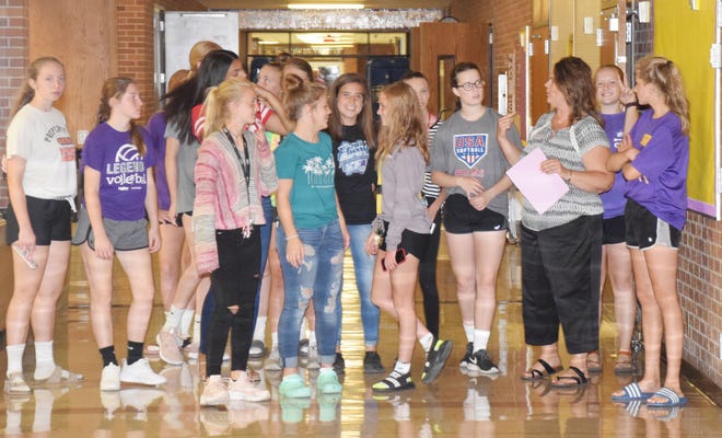 A group of incoming freshmen students take part in a scavenger hunt Monday evening at Watertown High School.