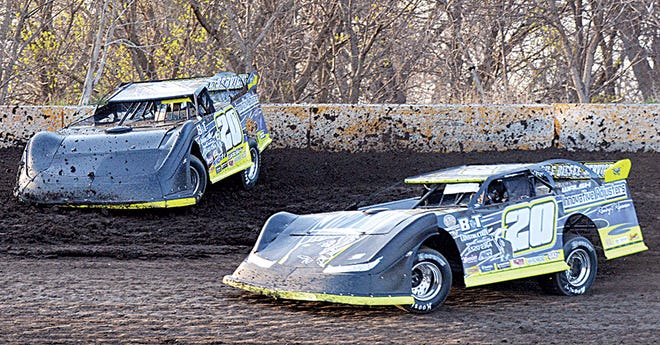 Watertown drivers Trevor (20T) and Doug Walsh (20) battle for position during a late model heat race Sunday night during the season-opening racing program at Casino Speedway. (Public Opinion photo by Garrett Dorneman)