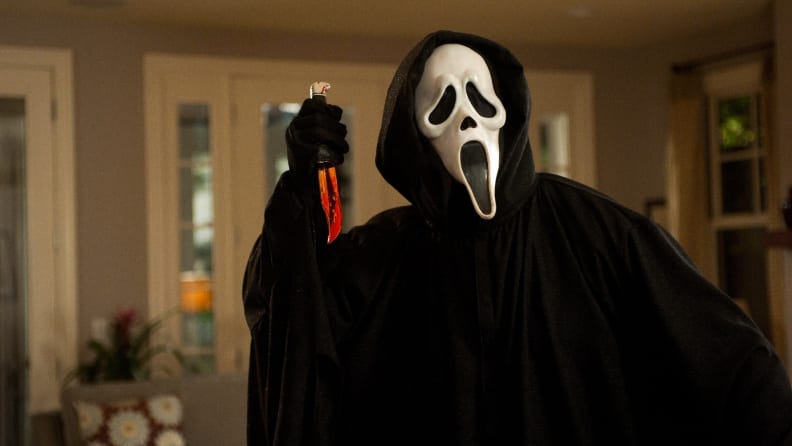 The ghostface killer in "Scream" holds a knife.