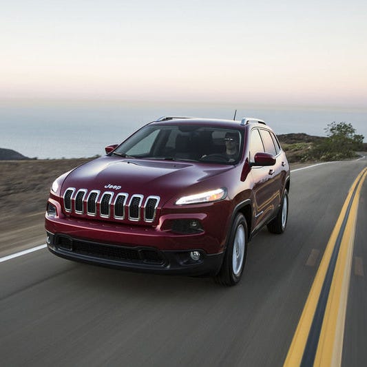 A 2015 Jeep Cherokee is shown.
