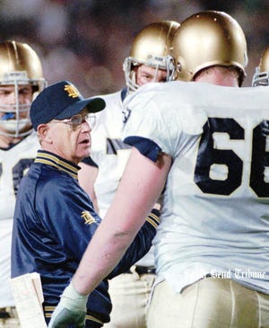 Notre Dame coach Lou Holtz talks to his players before the Jan. 1, 1994 Cotton Bowl vs. Texas A&amp;M.