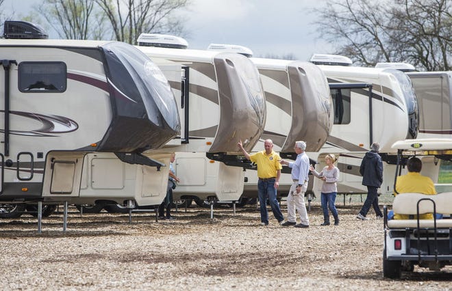 The RV industry continues to break records. Visitors look at RVs and motor homes at the fourth annual Spring Hall of Fame RV Show at the RV/MH Hall of Fame in Elkhart in this file photo. Tribune File Photo/ROBERT FRANKLIN
