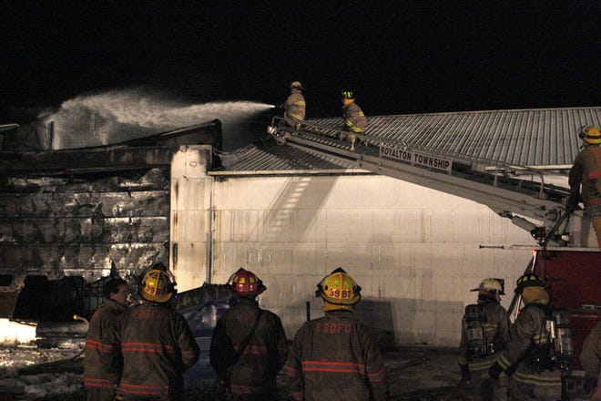 Royalton Township firefighters battle an early morning blaze Friday at 8030 Scottdale Road in Oronoko Township, Mich. Firefighters from six southwestern Michigan departments were called to the blaze. SBT Photo/FRED DODD