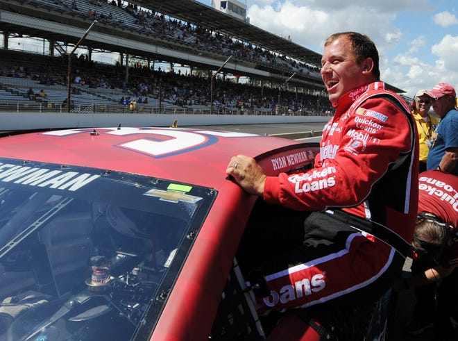 Sprint Cup Series driver Ryan Newman smiles as he climbs out of his car after qualifying for the pole position for the Brickyard 400 auto race at the Indianapolis Motor Speedway in Indianapolis, Saturday, July 27, 2013. Newman qualified with a speed of 187.531 mph. (AP Photo/Doug McSchooler)