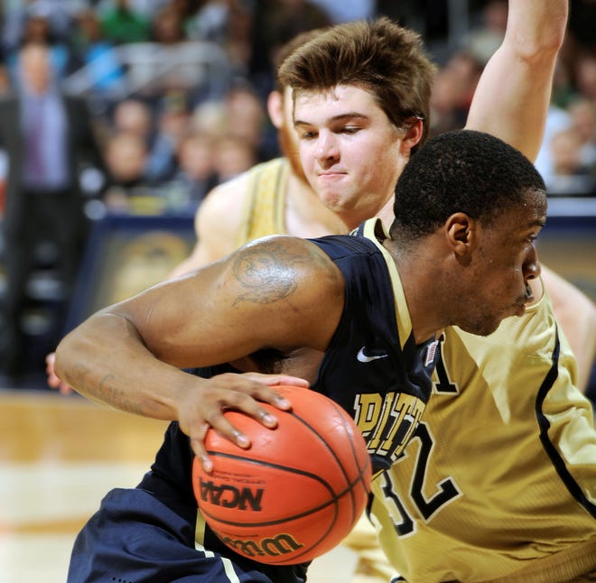 Pittsburgh guard Lamar Patterson drives the lane as Notre Dame guard Steve Vasturia defends in the second half of Saturday's game in South Bend, Ind. Pittsburgh won 85-81 in overtime. (AP Photo/JOE RAYMOND)