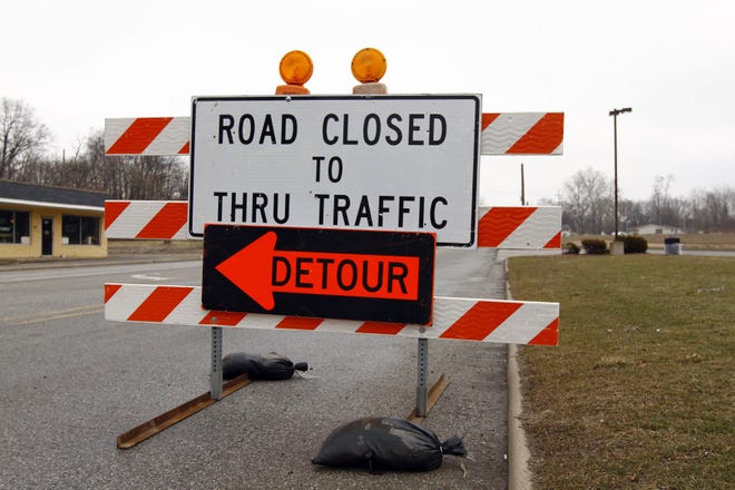 Road closed sign. Tribune file photo