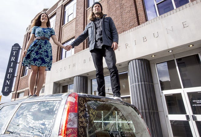 South Bend natives Nathaniel Paul Hoff and Jillian Speece of The Bergamot stand on top of the “Unity Car." A film by The Bergamot, "State of Unity" will be shown at The Acorn on July 14.
