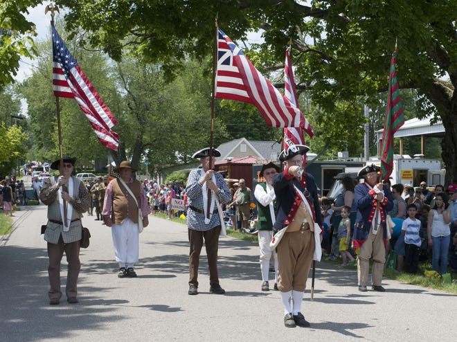 The Indiana Society of the Sons of the American Revolution color guard presents the colors Saturday at the 33rd annual Harrodsburg Heritage Days Festival. The color guard was among several entries in the annual parade. (Ernest Rollins / Herald-Times)