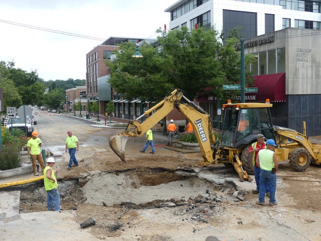 City of Bloomington Utilities workers address a water main break in July 2019 after a pipe ruptured at the intersection of Washington Street and East Kirkwood Avenue.