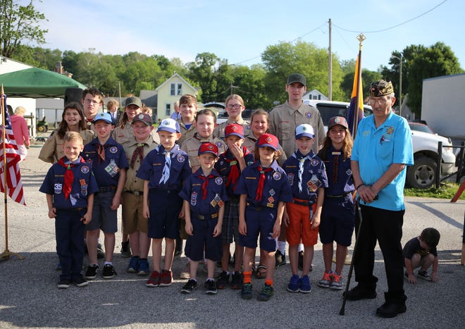 Cub Scout Pack 285 along with Scouts BSA members of Troop 119 and Troop 1119 did a Memorial Day flag ceremony at the Owen County Farmer’s Market on Memorial Day weekend. Those in attendance were, front row, from left: Jacob McDaniel, Logan May, Lucas Minor, Eliot Simkins, Edward Winkle and Londyn Frye. Middle row: Charlotte Bandy, Austin Minor, Elliott Page, Isabella May, Jessie McDaniel, Sophia Winkle and veteran Ted Mangin. Back row: Bryce McCullough, Maren Winkle, Jack Bandy, Sarah McCullough and Drew McCullough. The group also was fortunate enough to have two trumpet players from the Owen Valley Band and Guard play Taps during the ceremony. They were Gavin Truesdel and Abi Lanham. (Submitted / Spencer Evening World)