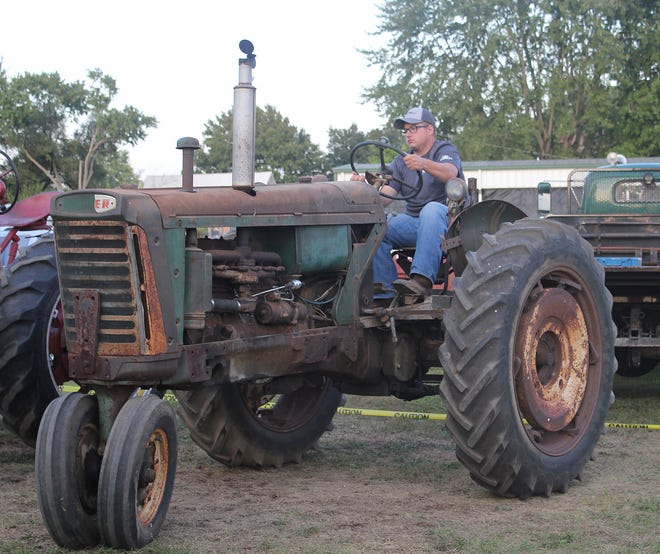 Tanner Strauch prepares to hook his Oliver 770 during the tractor pull at Old Settlers’ Picnic. (Krista Dayhoff / Spencer Evening World)