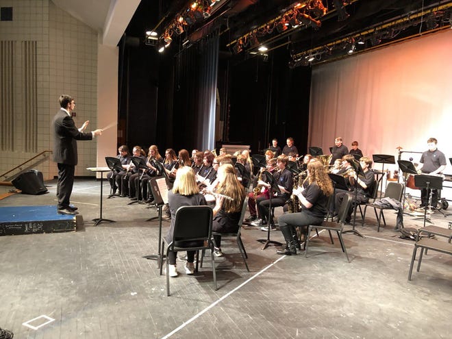 Student Teacher Theo Simpson conducts the eighth grade band during the Indiana Music Education Association Festival and Clinic held Friday, March 1 in the OVHS auditorium. (Submitted / Spencer Evening World