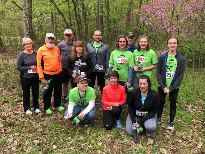 The YMCA/Friends of McCormick’s Creek 5K walk winners include, front row, from left: Doug Demshar, Joanne Allee and Davida Truax. Back row: Dee Franklin, Jim Canning, Ken Buzzard, Rachael Chastain, Joshua Smith, Trinity Bean, Steven Floyd, Brooke Bean and Sara Raser. (Submitted / Spencer Evening World)