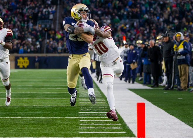 Notre Dame’s Braden Lenzy (25) keeps control of the ball to score as Boston College's Brandon Sebastian (10) tries to tackle him during the Notre Dame vs. Boston College NCAA college football game Saturday, Nov. 23, 2019 at Notre Dame Stadium in South Bend.