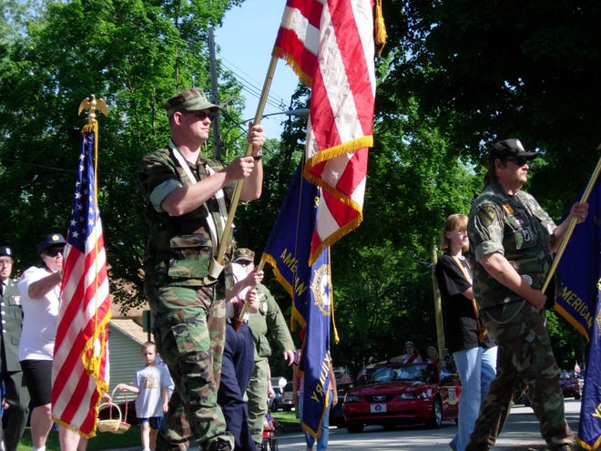 Veterans march to Silverbrook Cemetery in the Niles on a past Memorial Day. Tribune File Photo