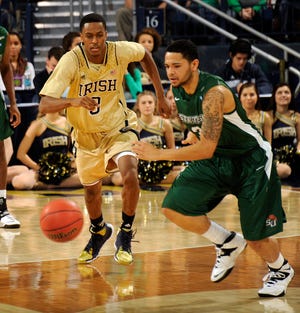 Stetson guard Glenn Baral, right, and Notre Dame guard V.J. Beachem chase a loose ball during the first half of an NCAA college basketball game on Sunday, Nov. 10, 2013, in South Bend, Ind. (AP Photo/Joe Raymond)