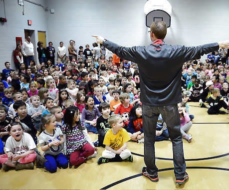 Chris Howell | Herald-TimesPrincipal Mark Conrad talks to his students during an assembly to celebrate global awareness and their annual Read Across America program at Rogers Elementary School on Friday. Chris Howell | Herald-Times