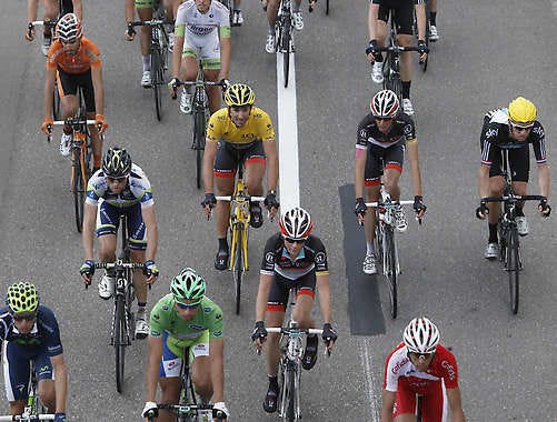 Fabian Cancellara of Switzerland, wearing the overall leader’s yellow jersey, Peter Sagan of Slovakia, wearing the best sprinter’s green jersey, and Bradley Wiggings of Britain, right with yellow helmet, ride in the pack during the sixth stage of the Tour de France Friday. Laurent Cipriani | Associated Press
