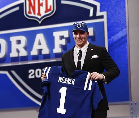 Defensive end Bjoern Werner from Florida State holds up the team jersey after being selected 24th overall by the Indianapolis Colts in the first round of the NFL football draft, Thursday, April 25, 2013 at Radio City Music Hall in New York. (AP Photo/Jason DeCrow)