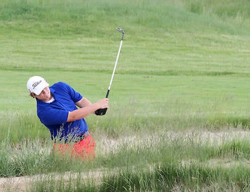 Martinsville's No. 1 golfer Baylor Payne hits out of the bunker on the 17th hole during Saturday's Mid-State Conference meet at Heartland Crossing Golf Links. Payne received all-conference honors with his score of 80. Photo by Melissa Dillon.